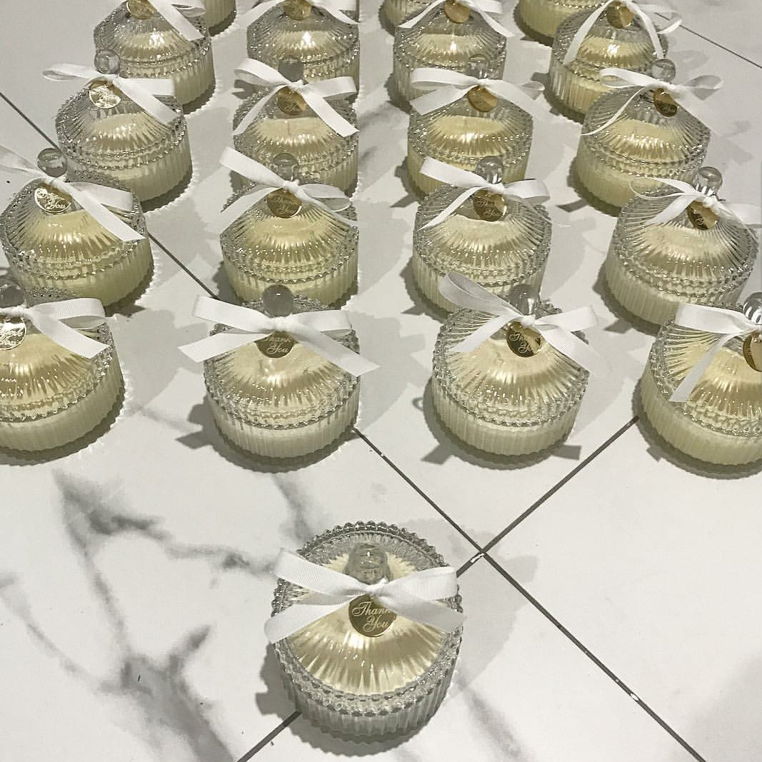 Custom candle gifts and favors by Soleil-Radiant-Aromas, featuring elegant candles with personalized labels and decorative packaging.